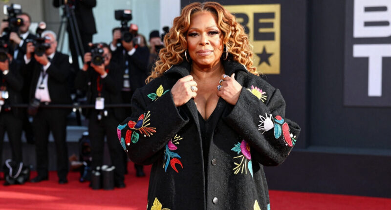 Queen Latifah Bundles Up in a Bold, Oversized Coat on the 2026 BET Awards Red Carpet